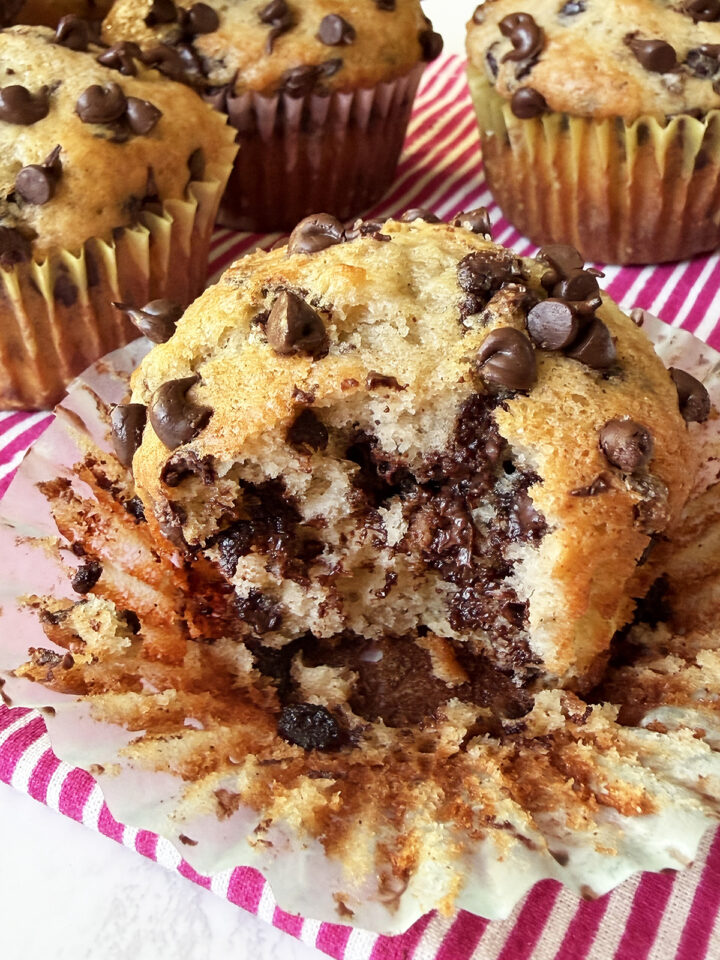 Banana chocolate chip muffin with bite taken out.