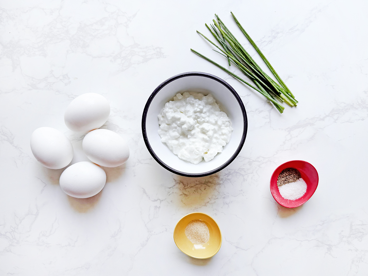 Ingredients on a counter for cottage cheese scrambled eggs.